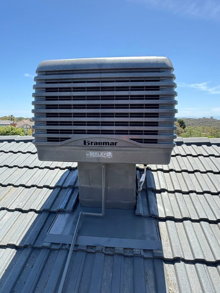 Braemar evaporative cooling unit installed on a tiled residential roof
