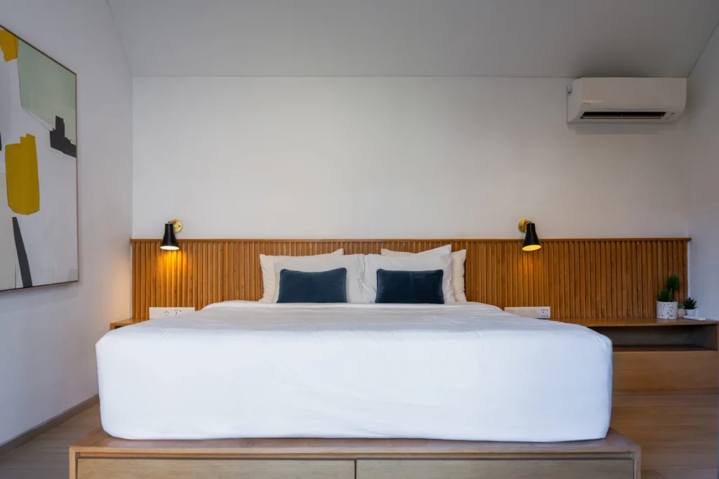 Modern bedroom with a wall-mounted split-system air conditioner
